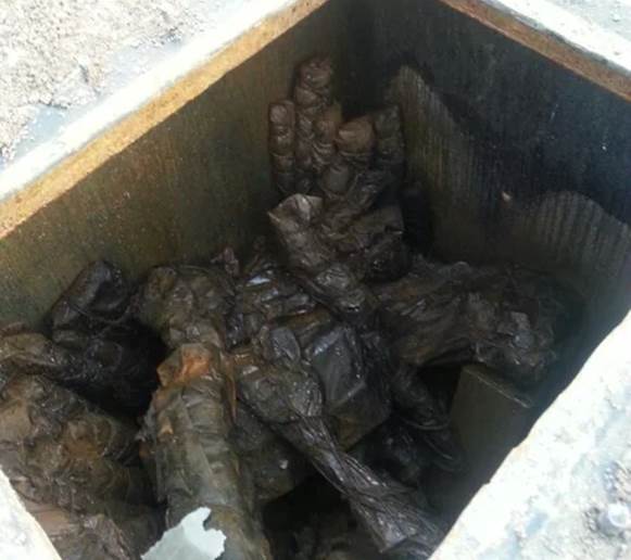 A pile of dirt in a square holeDescription automatically generated with medium confidence